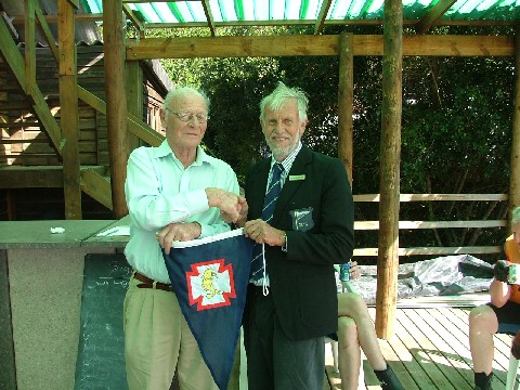 Tony Rendell handing over Burgee from Parkstone Yacht Club in Poole Harbour